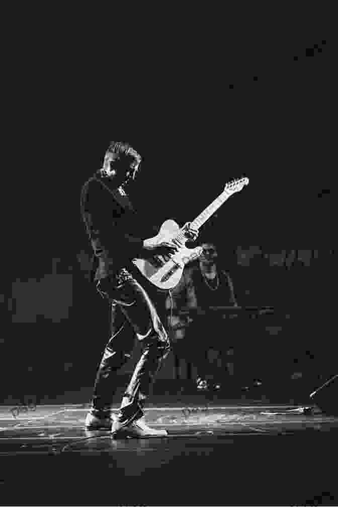 A Photo Of A Person Playing A Guitar On A Stage. The BANG Story: From The Basement To The Bright Lights